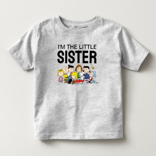 Camiseta Infantil O Gangue do Peanuts Eu Sou a Irmã Mais Nova