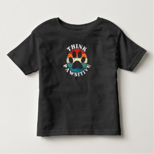 Camiseta Infantil Pata de Cachorro Pensa em Camisa-T Pawsitiva