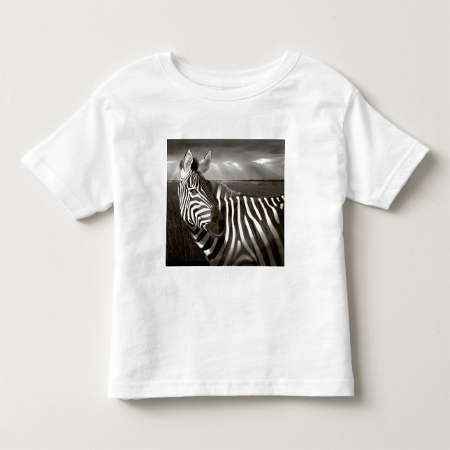 Camiseta Infantil Quênia. Preto e branco de zebra e puro. (Frente)
