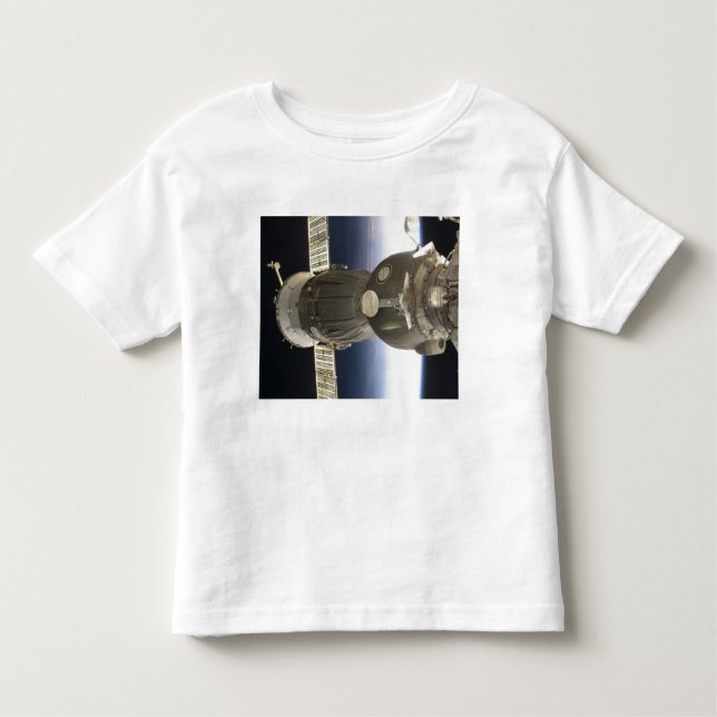 Camiseta Infantil Uma nave espacial Soyuz recuada pela Terra (Frente)