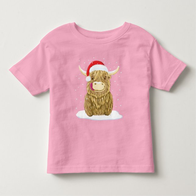 Camiseta Infantil Vaca escocesa das montanhas na neve do Natal (Frente)