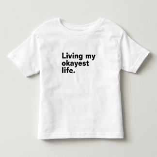 Camiseta Infantil Vivendo minha vida mais agradável. design de texto