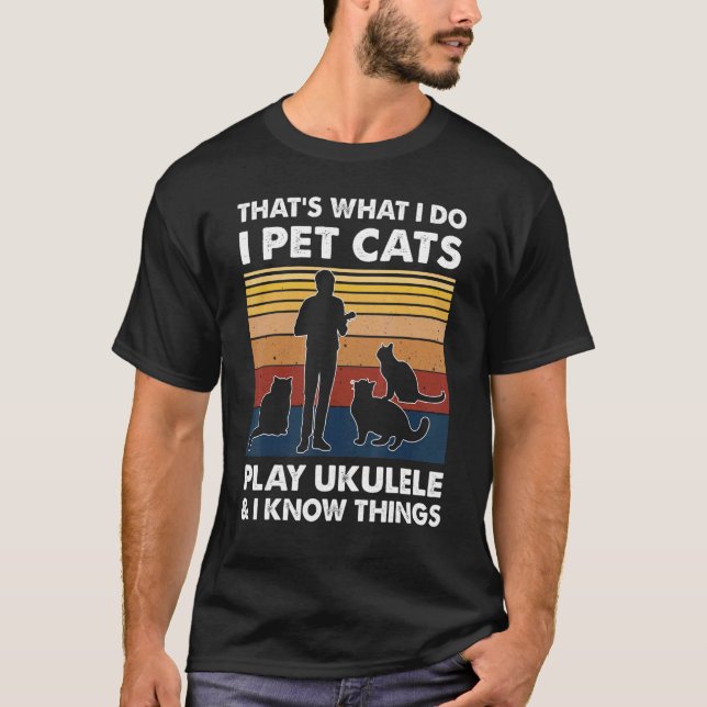 Camiseta Isso É O Que Eu Faço Eu Acaricio Gatos Toco Ukulel (Frente)