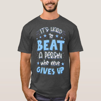Camiseta It's Hard Beat A Person Who Never Gives Up Motivat
