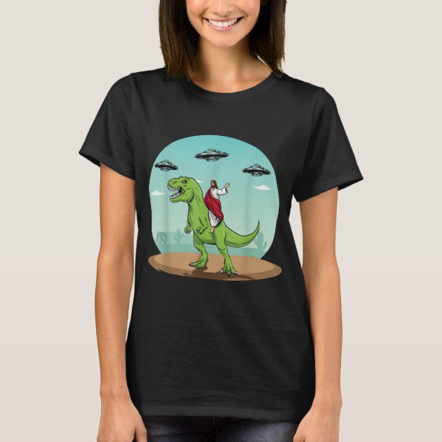 Camiseta Jesus Dirigindo Um Dinossauro Engraçado OVNI Alien (Frente)