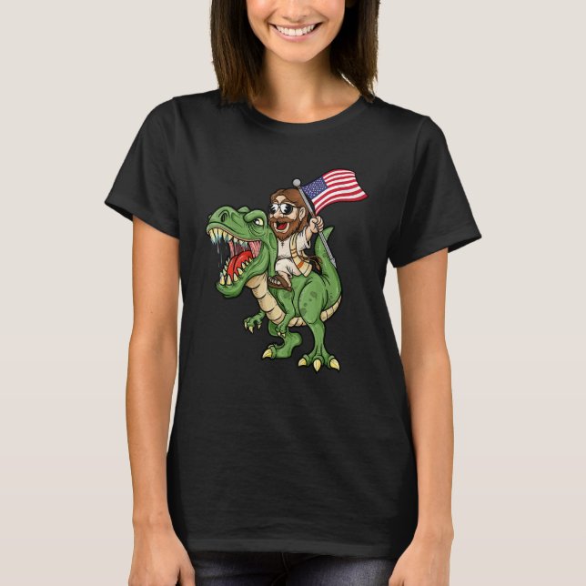 Camiseta Jesus Riding A Tyrannosaurus Rex Dinosaur USA Flag (Frente)