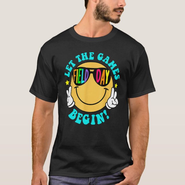 Camiseta Let The Games Field Day Begin Smile Face Groovy Te (Frente)