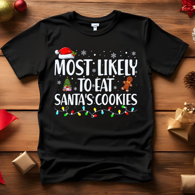 Camiseta Mais propenso a comer todos os acasalamentos de PA (FUNNY CHRISTMAS MOST LIKELY TO EAT SANTA'S COOKES CHRISTMAS TREE GINGERMAN AND LIGHTS)