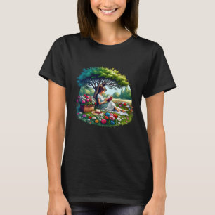 Camiseta Menina lendo sob uma árvore cercada por flores