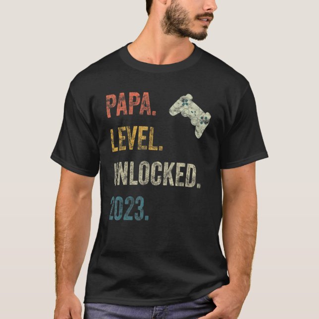 Camiseta Mens Papa Nível Desbloqueado 2023 Gravidez Gamer E (Frente)