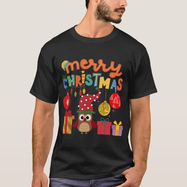CAMISETA MERRY CHRISTMAS APRESENTA PAPAIS NOEIS DE LUZ ANO  (Frente)