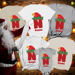 Camiseta Monograma personalizado com nome natalício<br><div class="desc">Crie memórias de feriado com o Monograma Personalizado com Camisa de Natal da Família Name. Estas camisas de Natal da família costume são concebidas para tornar as suas celebrações mais festivas e pessoais. Cada camisa apresenta um monograma lúcido, enfeitado com um chapéu de elfo de Natal, acrescentando um elemento divertido...</div>