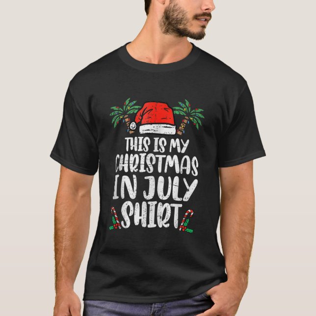 Camiseta Natal em julho Engraçado Santa Hat Summer Beach Va (Frente)