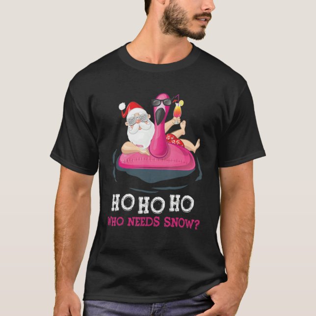 Camiseta Natal Em Papais noeis De Julho Navegando Flamingo  (Frente)