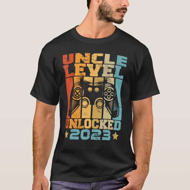 Camiseta Nível do Tio Mens Desbloqueado 2023 Anúncio do Beb (Frente)