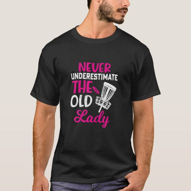 Camiseta O Golfe Do Disco Das Mulheres Nunca Subestima A Ve (Frente)