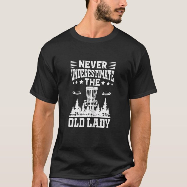 Camiseta O Golfe Do Disco Das Mulheres Nunca Subestima A Ve (Frente)