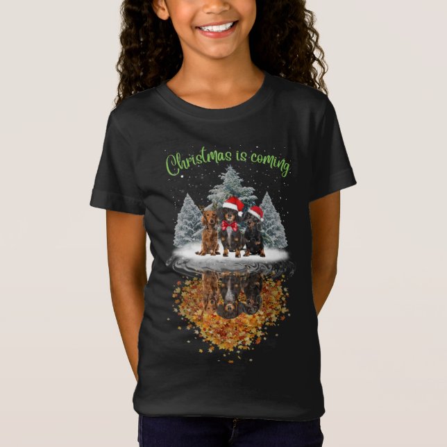 Camiseta O Natal Dachshund Está Chegando No Teto Gráfico De (Frente)