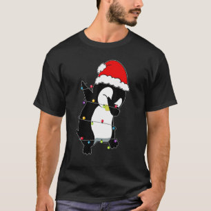 Camiseta O Pinguim De Natal Ilumina O Chapéu Do Pai Natal P
