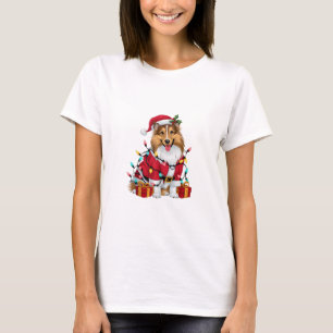 Camiseta Papais noeis de Iluminação Xmas Sheltie Dog Natal 