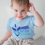 Camiseta Para Bebê Blue Dreidel Hanukkah Toddler<br><div class="desc">Dreidel dreidel dreidel em três tons diferentes de azul com um sonho azul para Chanukah.</div>