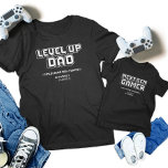 Camiseta Para Bebê Nível para Cima Pai do Jogador Filha Próxima Geraç<br><div class="desc">Celebre o melhor vínculo de jogos com nossas t-shirts correspondentes ao "Pai para jogadores e próximo jogador de gen"! Com designs retrorados "Pai de Nível Superior" e "Jogador de Próxima Geração", estas camisas são perfeitas para Dia de os pais, aniversários ou qualquer evento de jogos. Mostre sua paixão compartilhada com...</div>