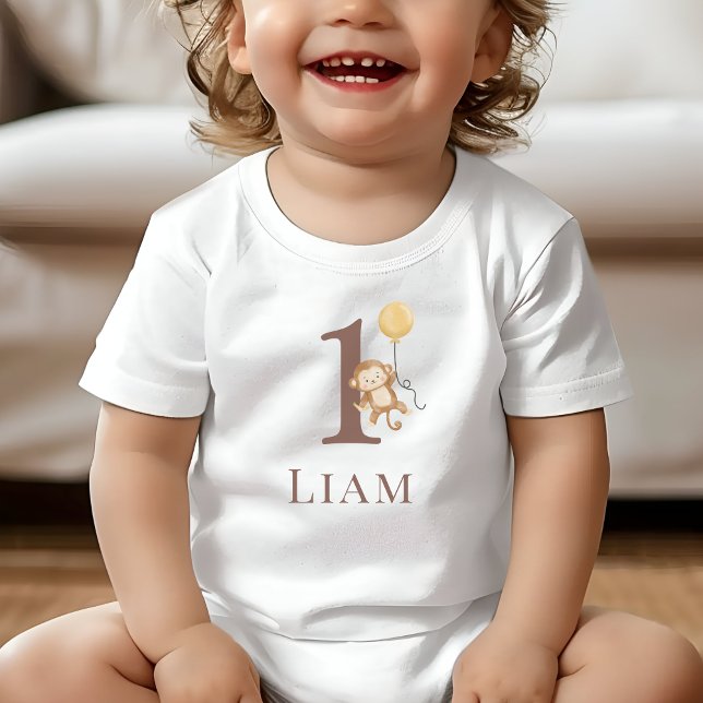 Camiseta Para Bebê Número de aniversário do pequeno macaco (Toddler wearing a white T-Shirt with the number 1 and a monkey holding a balloon.)