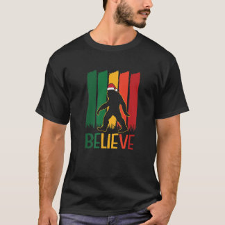 Camiseta Pé Grande Acredita No Natal Engraçado Retro X-Mas