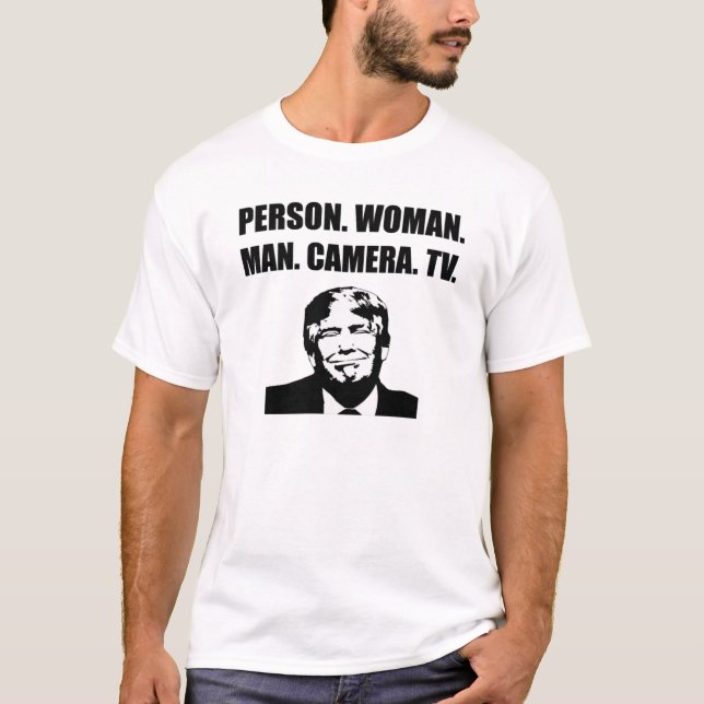 Camiseta Pessoa. Mulher. Cara. Câmera. TV. Anti-Trump (Frente)
