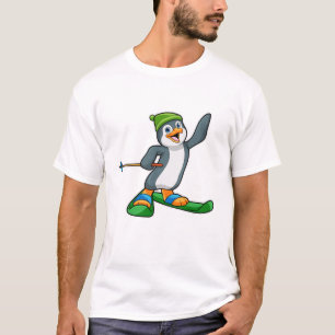 Camiseta Pinguim como esquiador com esqui e Boné