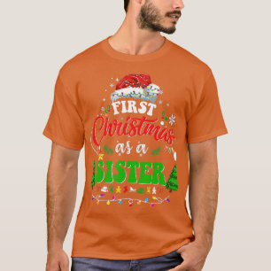 Camiseta Primeiro Natal Como Irmã Santa Hat Ugly Xmas 2