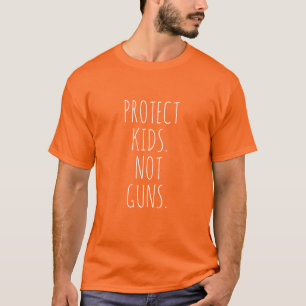 Camiseta Proteja crianças Não armas brancas laranja manuscr