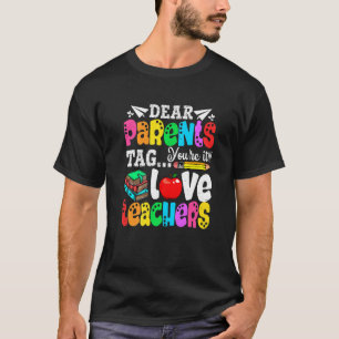 Camiseta Queridos pais dizem que é o primeiro dia da escola