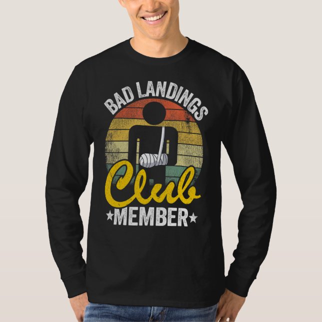 Camiseta Ruim Landings Club Membro Da Mão Quebrada Consiga  (Frente)