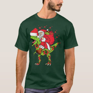Camiseta Santa Claus Riding Dinosaur T rex Christmas Snow