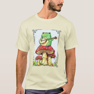 Camiseta Sapo cottagecore com casa de cogumelo tocando banj
