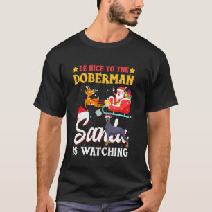 Camiseta Seja Bom Para o Papai Noel do Cachorro Doberman Es