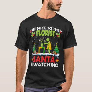 Camiseta Seja legal com os Papais noeis floristas Feliz Nat