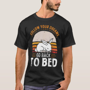 Camiseta Siga Seus Sonhos Volte Para A Cama Dormindo Coelhi