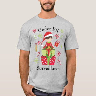 Camiseta Sob o feriado do Natal da fiscalização do duende