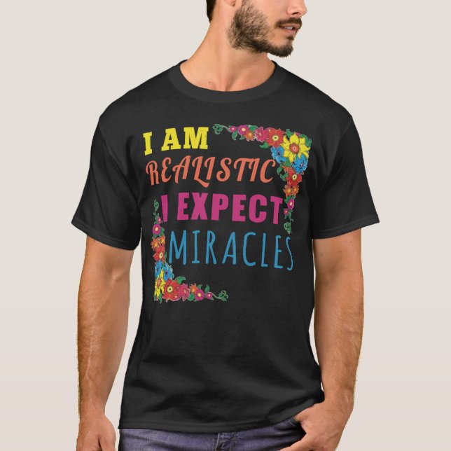 Camiseta Sou realista. Eu espero milagres (Frente)