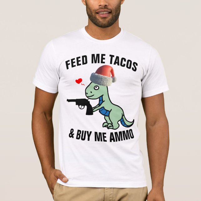 CAMISETA T-REX COM T-SHIRTS DE NATAL ENGRAÇADO DE ARMA (Frente)