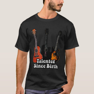 Camiseta Talentoso desde o nascimento. Guitarras coloridas