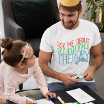 Camiseta Terapêutica Ocupacional Bonita Pergunte-Me Sobre O<br><div class="desc">Uma camiseta fofa para o melhor terapeuta ocupacional do mundo. Um presente que diz "Pergunte-me sobre a terapia ocupacional" em vermelho, verde e azul com um golfinho bonito. Um presente de excelente para crianças OT. As crianças beneficiam muito da terapia ocupacional. *As imagens utilizadas neste item são licenciadas e ©...</div>