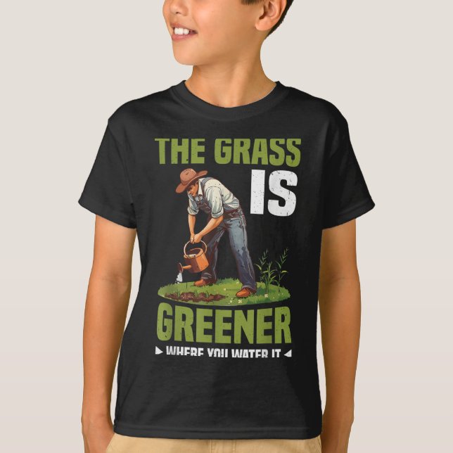Camiseta The Gr Is Greener Where You Water It Motivational  (Frente)