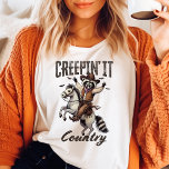 Camiseta "Ti" "It Country Vintage Raccoon Halloween"<br><div class="desc">Celebrar o Halloween com uma reviravolta de campo com esta "Creepin'It Country Vintage Raccoon Halloween Shirt". Com um guaxinim adorável vestido de vaqueiro e uma citação divertida do "País da Criança", esta camisa é perfeita para qualquer um que ama o Halloween e as vibrações do campo. Feito de materiais de...</div>