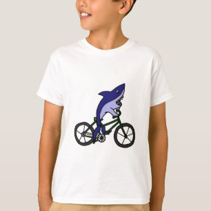 Camiseta Tubarão azul do divertimento que monta a biciclet