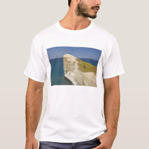 Camiseta Turistas no topo do penhasco na Tunnel Beach