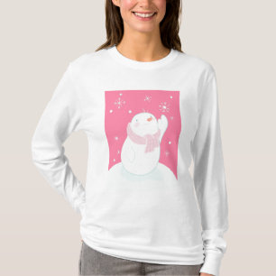 Camiseta Um boneco de neve que alcança para um floco de