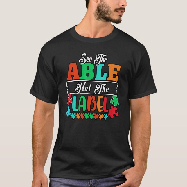 Camiseta Veja O Able Not The Label Quebra-cabeça Autism Con (Frente)
